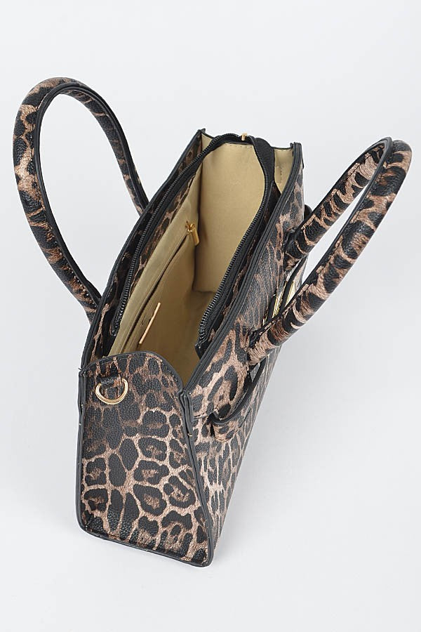 Top view of the open leopard print handbag revealing its beige interior and zippered pocket.