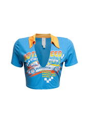 Blue racing-themed graphic shirt with vibrant yellow collar and detailed speed-inspired print on the front.