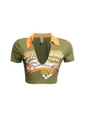 Olive green racing-themed graphic shirt with vibrant yellow collar and detailed speed-inspired print on the front.