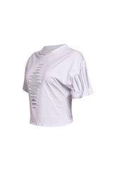 Side view of White Bogomore Spine Tee highlighting the edge of its unique spine-like slits