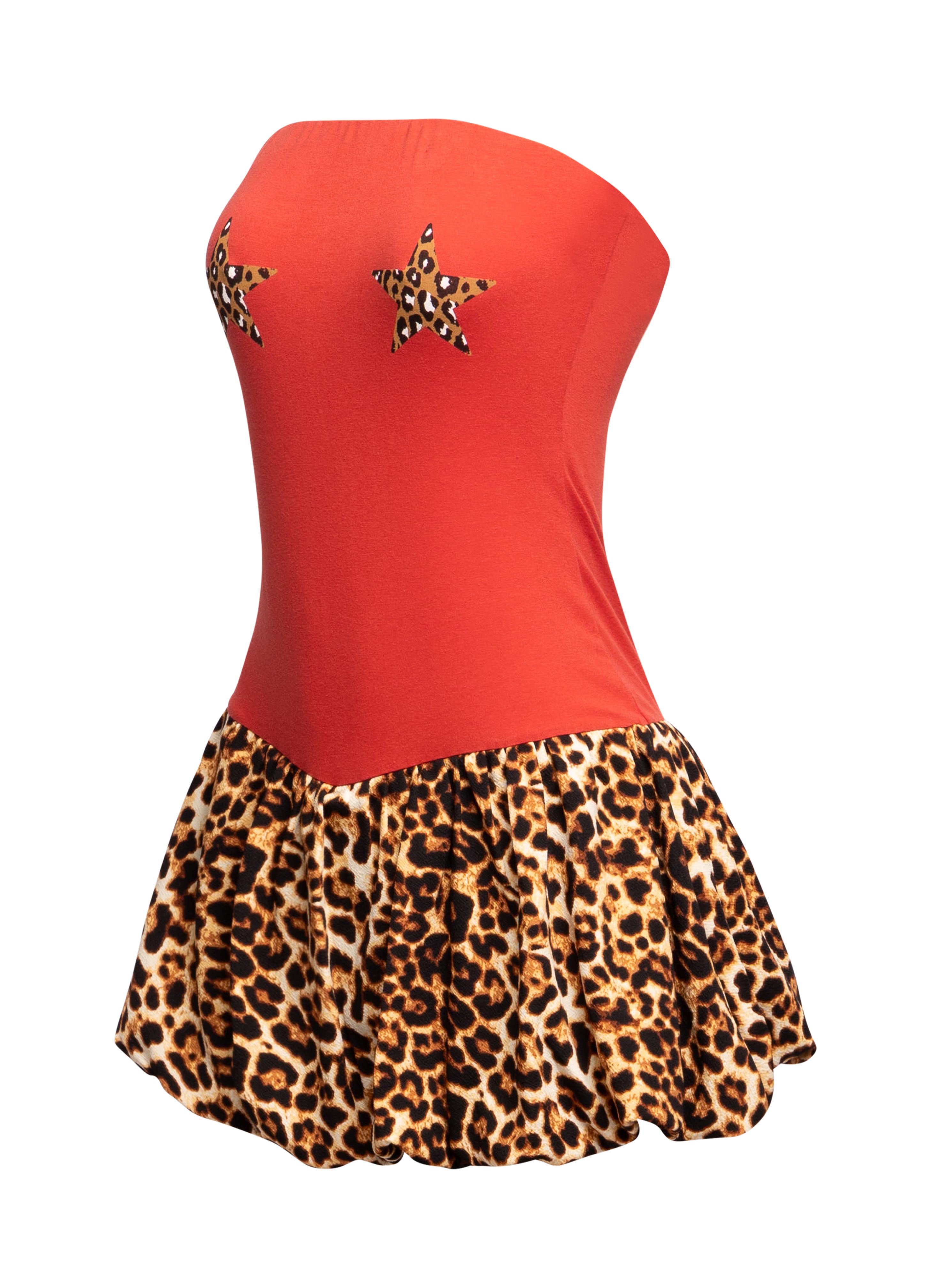  Left side view of Bogomore’s Leopard Star Flare Dress highlighting the side silhouette and flare design.