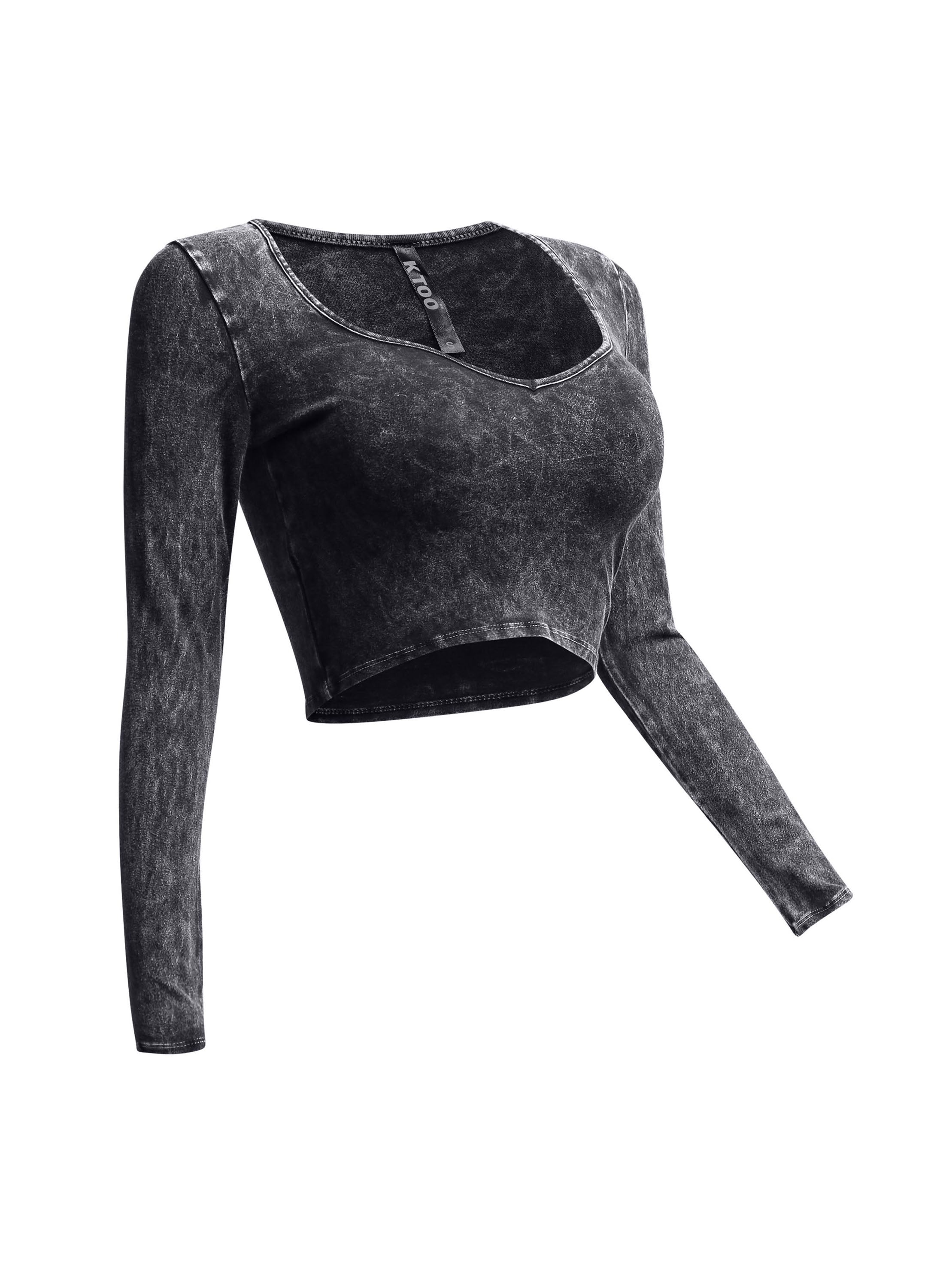 Right side view of black vintage wash crop top with form-fitting long sleeves.