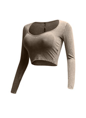 Left side view of beige vintage wash long sleeve crop top with a form-flattering fit.