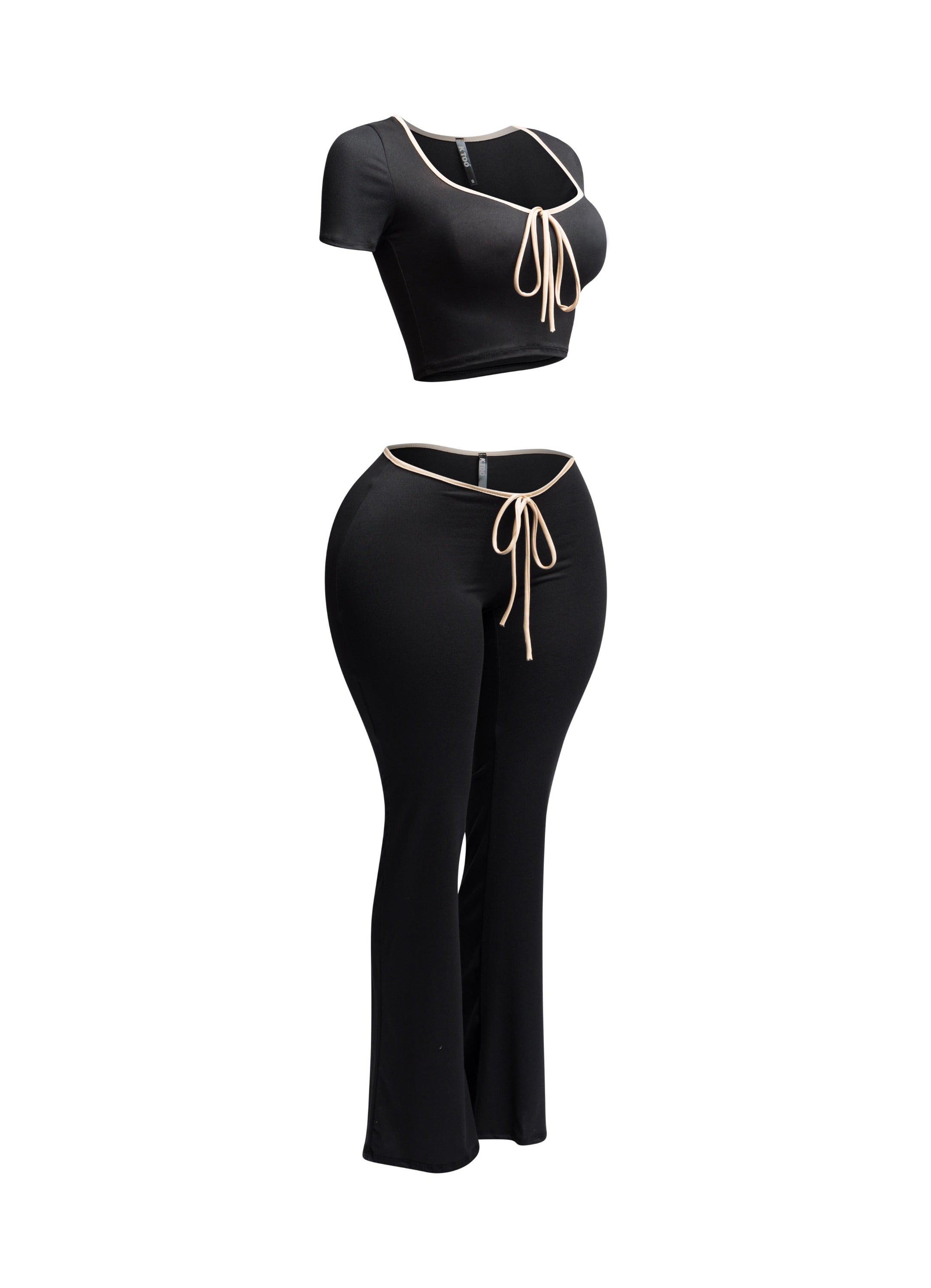 Side view of black and nude trim two-piece set with a tie-front crop top and high-waisted flared pants.