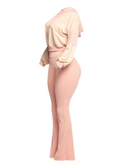 Modern peach lounge set featuring a ribbed cropped hoodie and flared pants with a high-waisted design. A must-have outfit for a fashionable yet comfortable casual look.