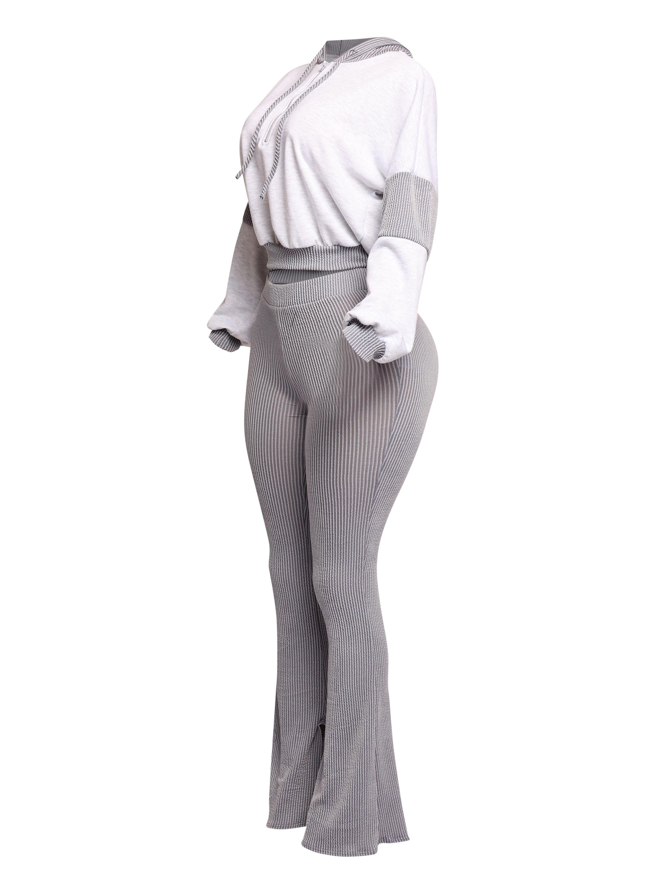 Chic ribbed two-piece set in a soft gray tone, featuring a relaxed cropped hoodie and high-waisted flared pants for a comfortable yet elevated everyday look.