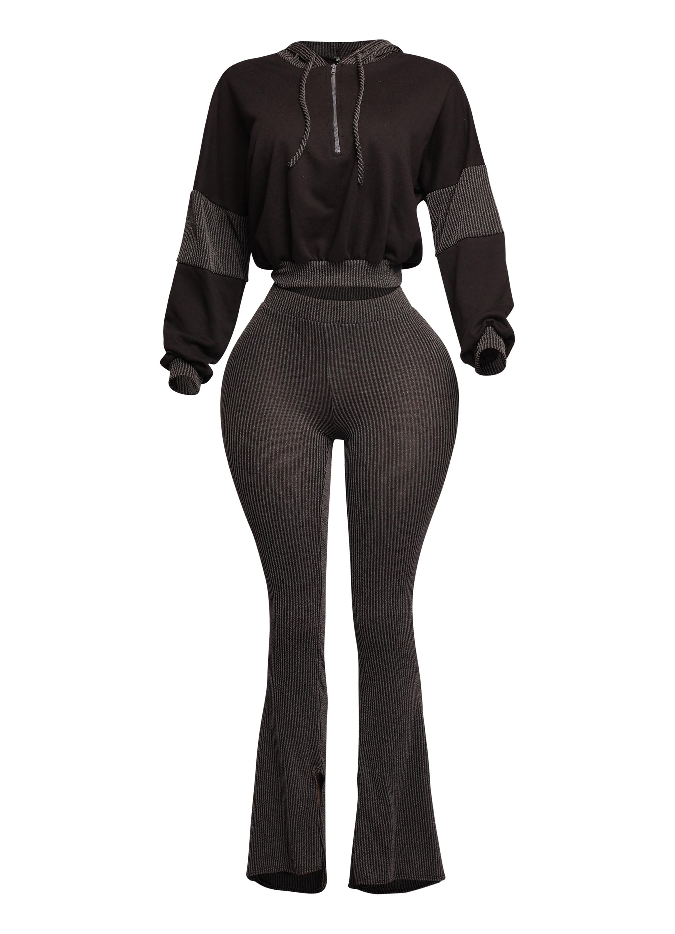 Sleek black two-piece lounge set featuring a cropped hoodie and high-waisted flared pants with a ribbed design. Perfect for a bold, modern, and stylish loungewear look.