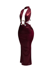 Side view of burgundy metallic maxi dress with body-hugging fit and snake trim accents.