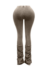 Back view of brown vintage vibe ruched leggings with flare leg and retro detailing.